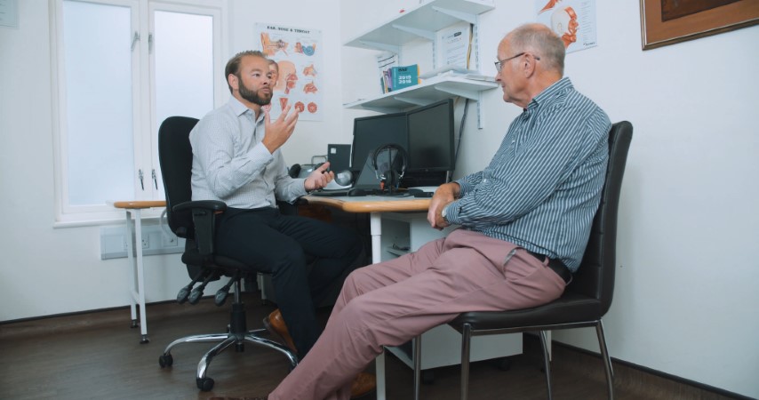 Audiologist carrying out a hearing consultation with a client
